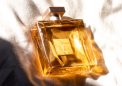 square perfume bottle with golden glow